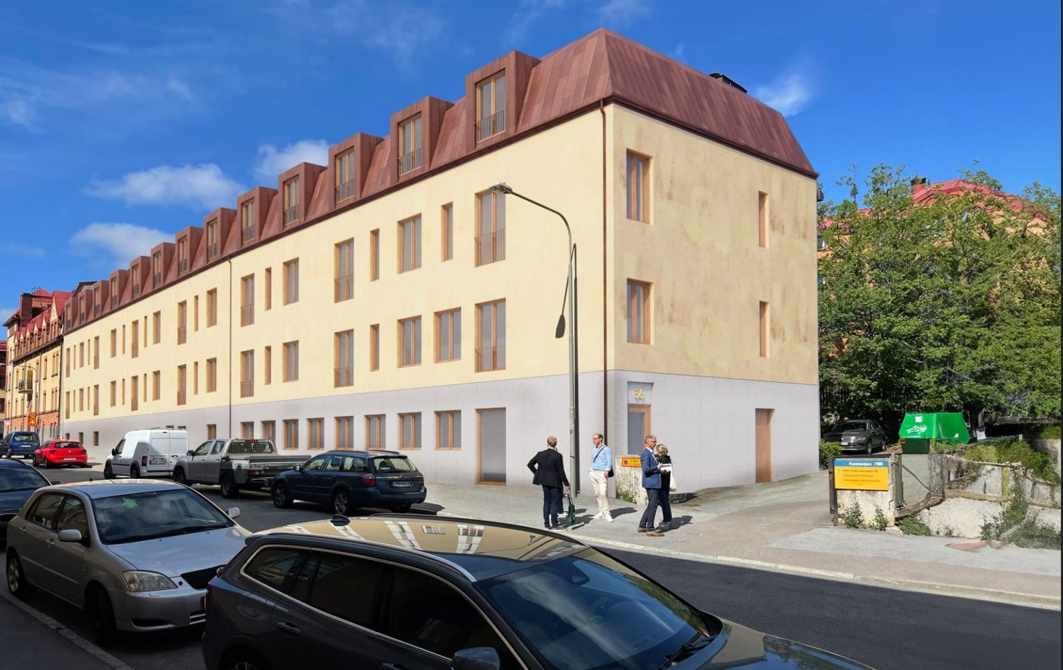 byggnad bredvid en bilväg och parkerade bilar